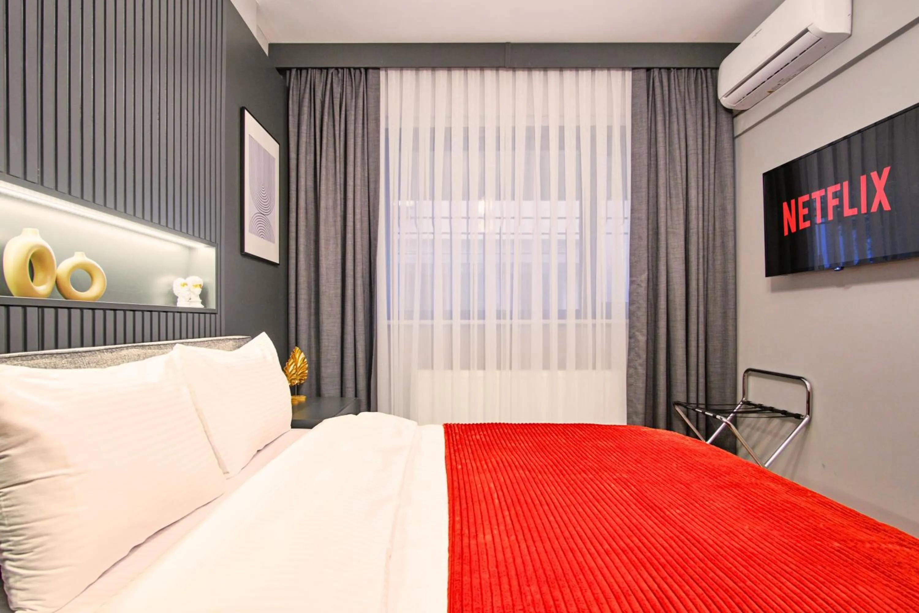 Bed in TAKS-INN Hotel