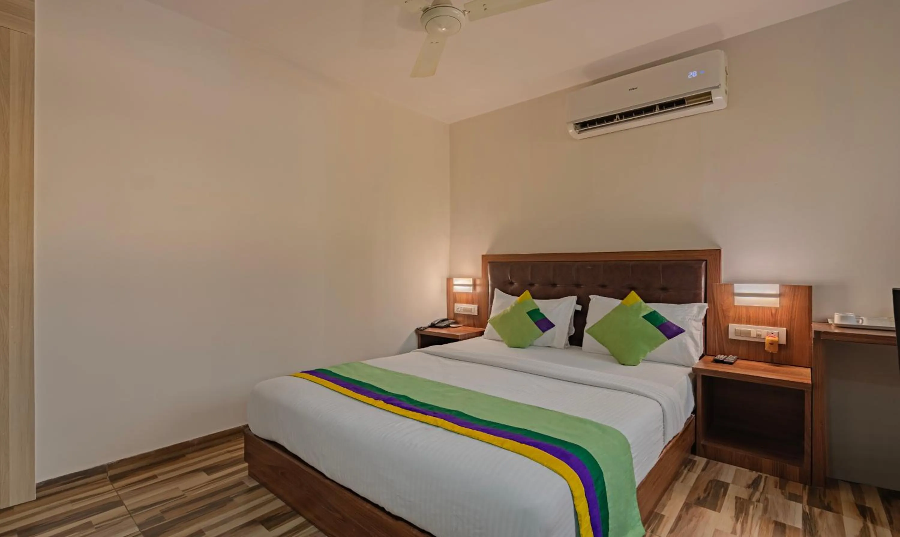 Bedroom, Bed in Treebo Seven Olives