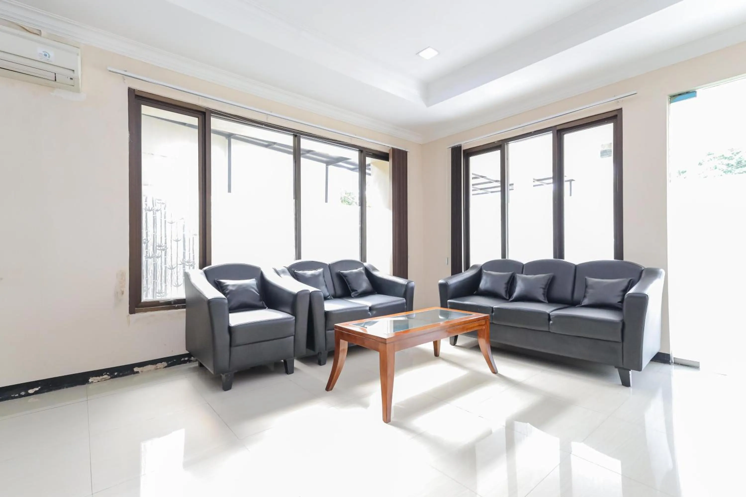 Living room in Urbanview Roemah Tebet by RedDoorz
