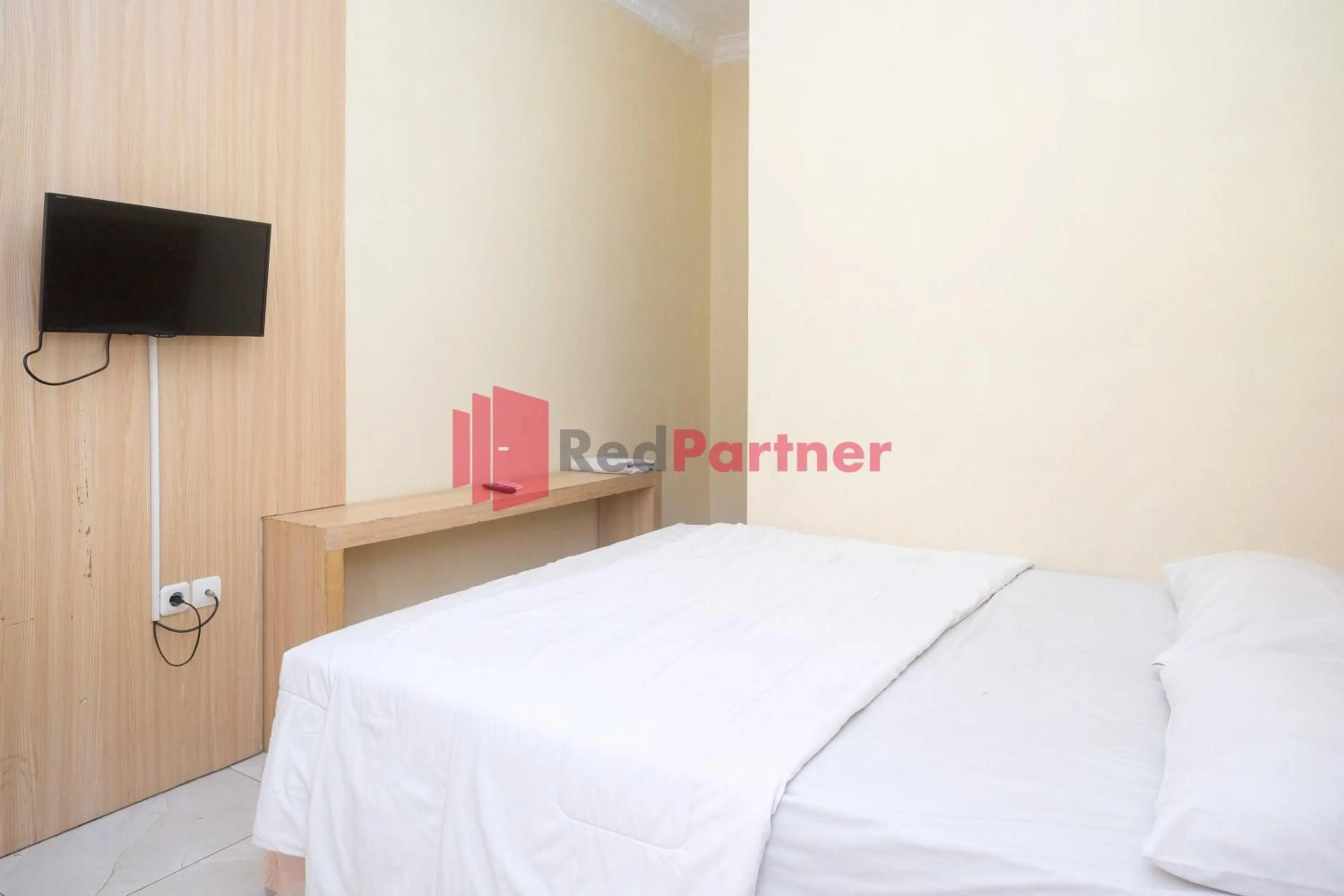 Bed in Wisma Fortuna Syariah Mitra RedDoorz