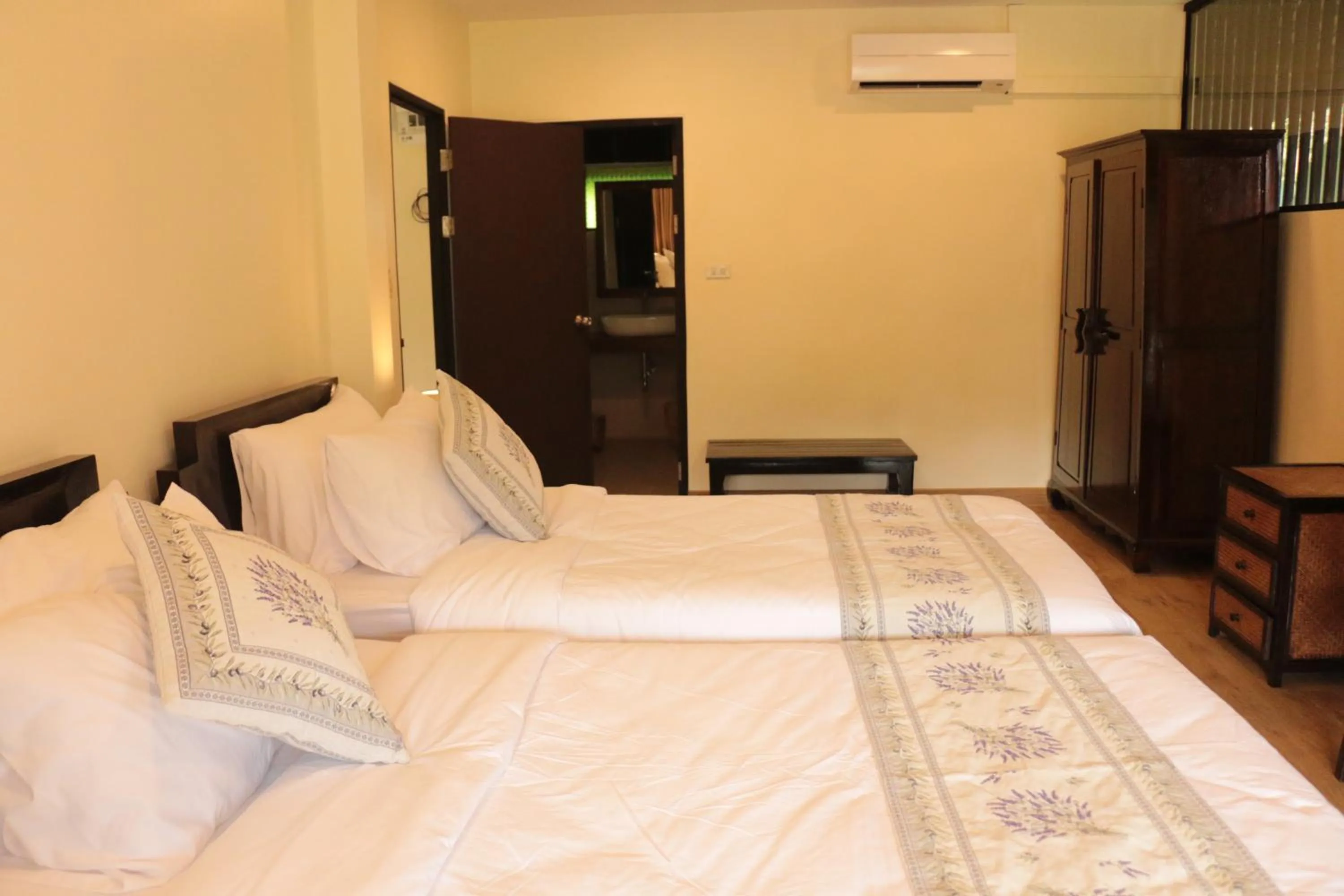 Bed in Le Baan Thai Boutique Villa