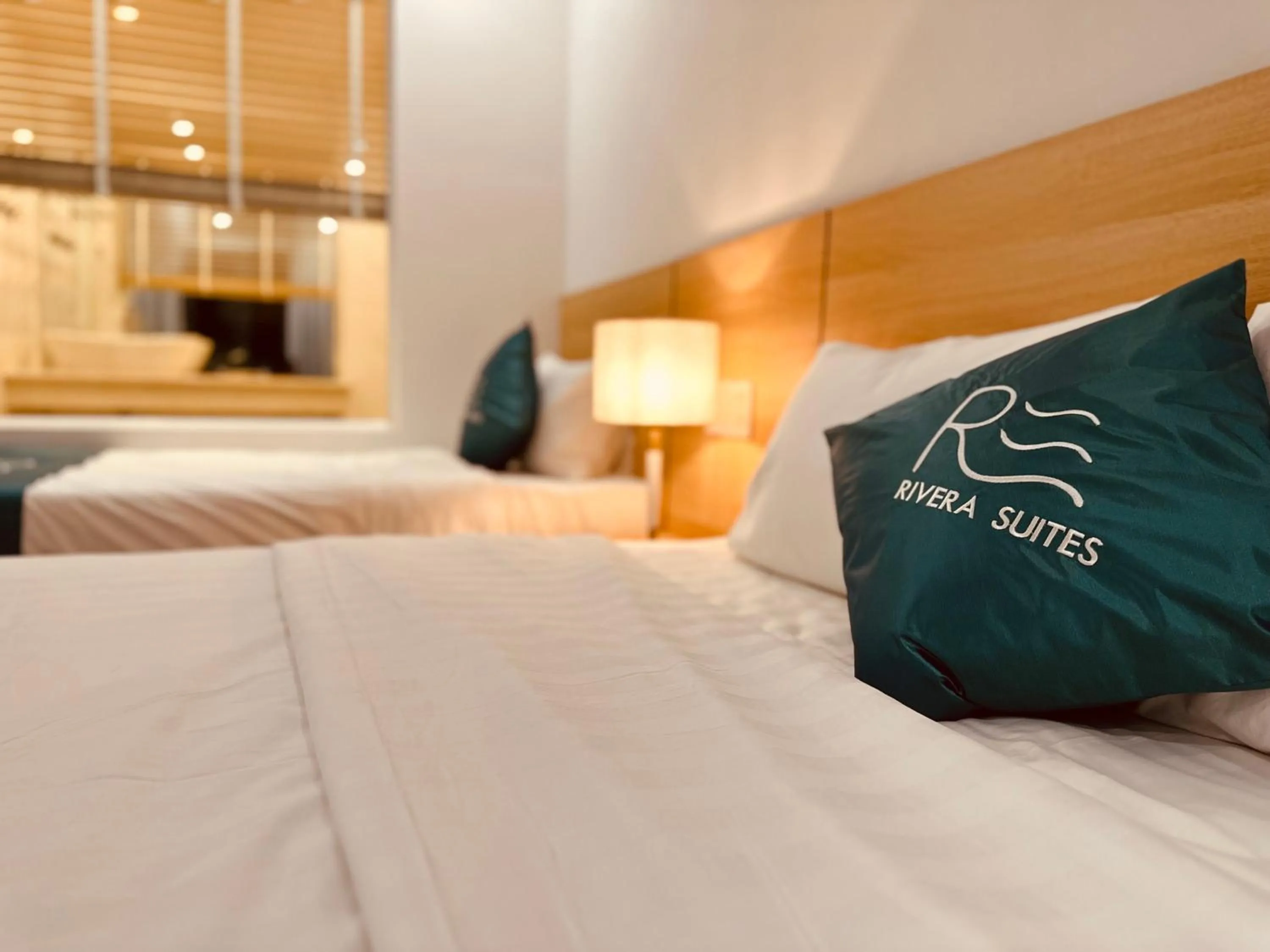 Bed in Rivera Suites