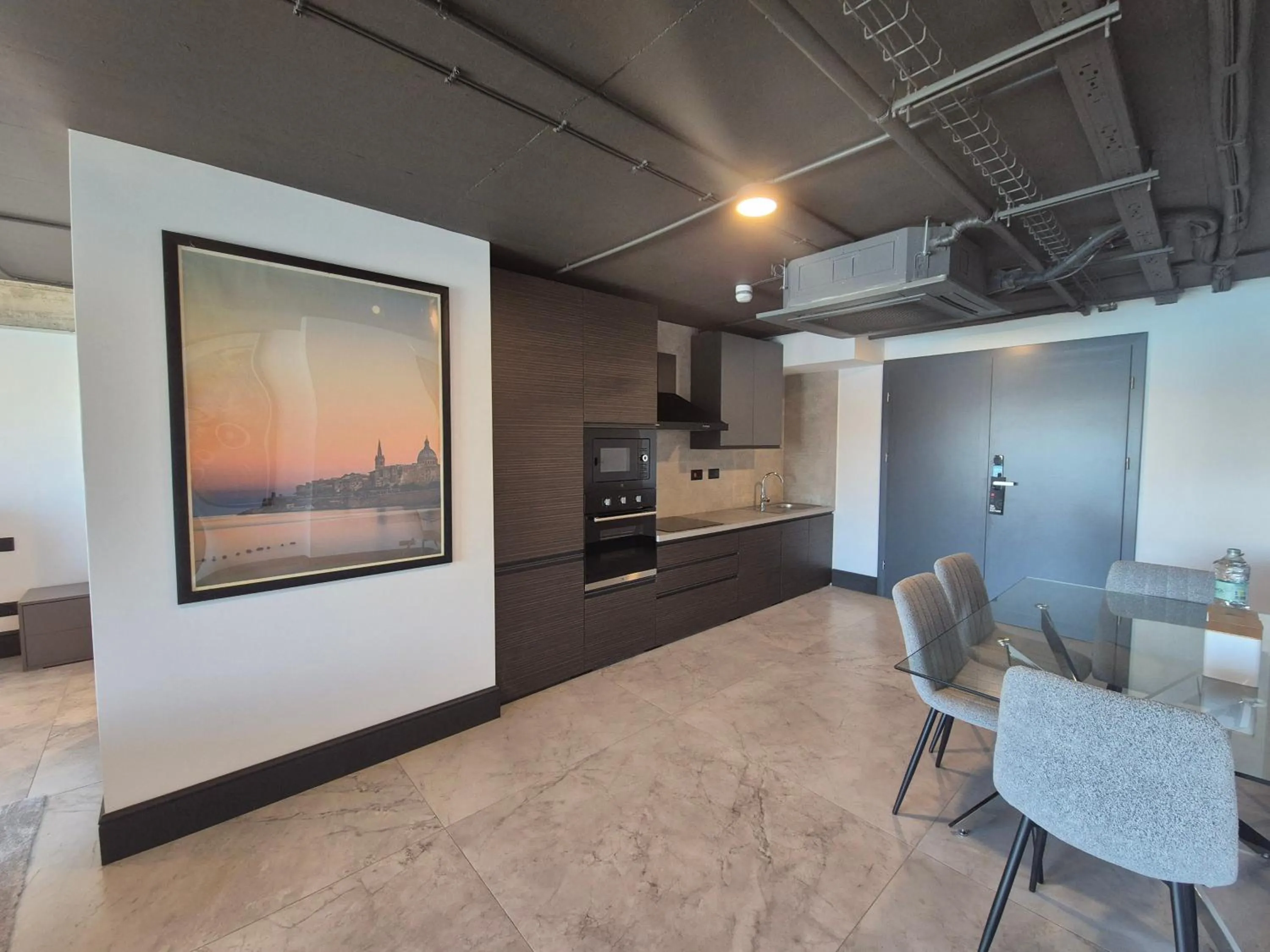 Kitchen or kitchenette in The Londoner Hotel Sliema