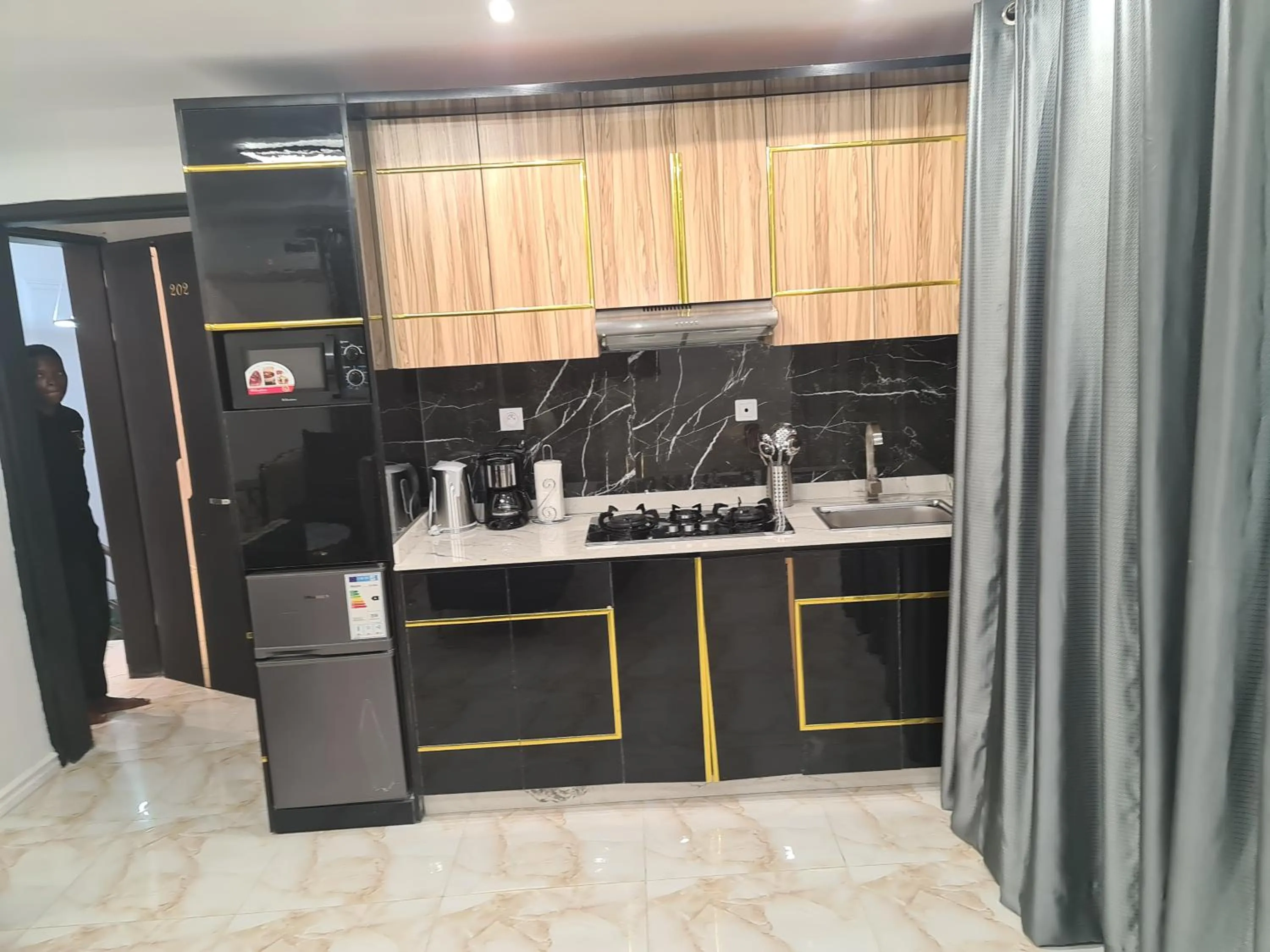 Kitchen or kitchenette in Suna' a Home Bonapriso