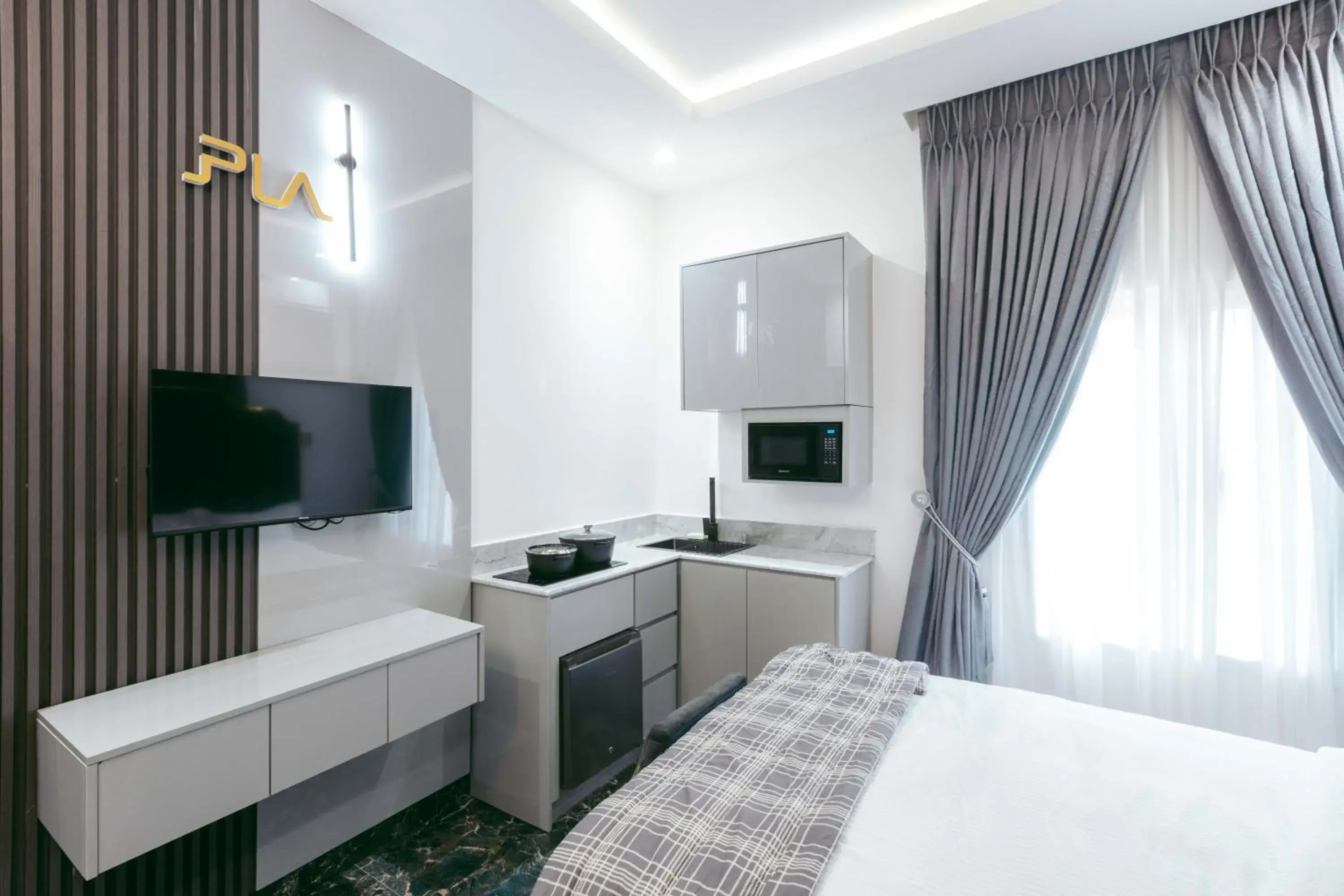 Deluxe Double Room (2 Adults + 1 Child) in Phoenix Luxury Apartments Deluxe Double Room (2 Adults + 1 Child) in Phoenix Luxury Apartments