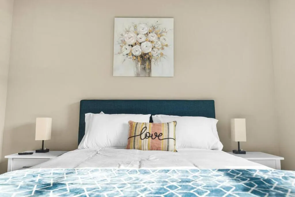 Bed in Elegant 1BR/1BA Condo with Pool, Gym and Laundry