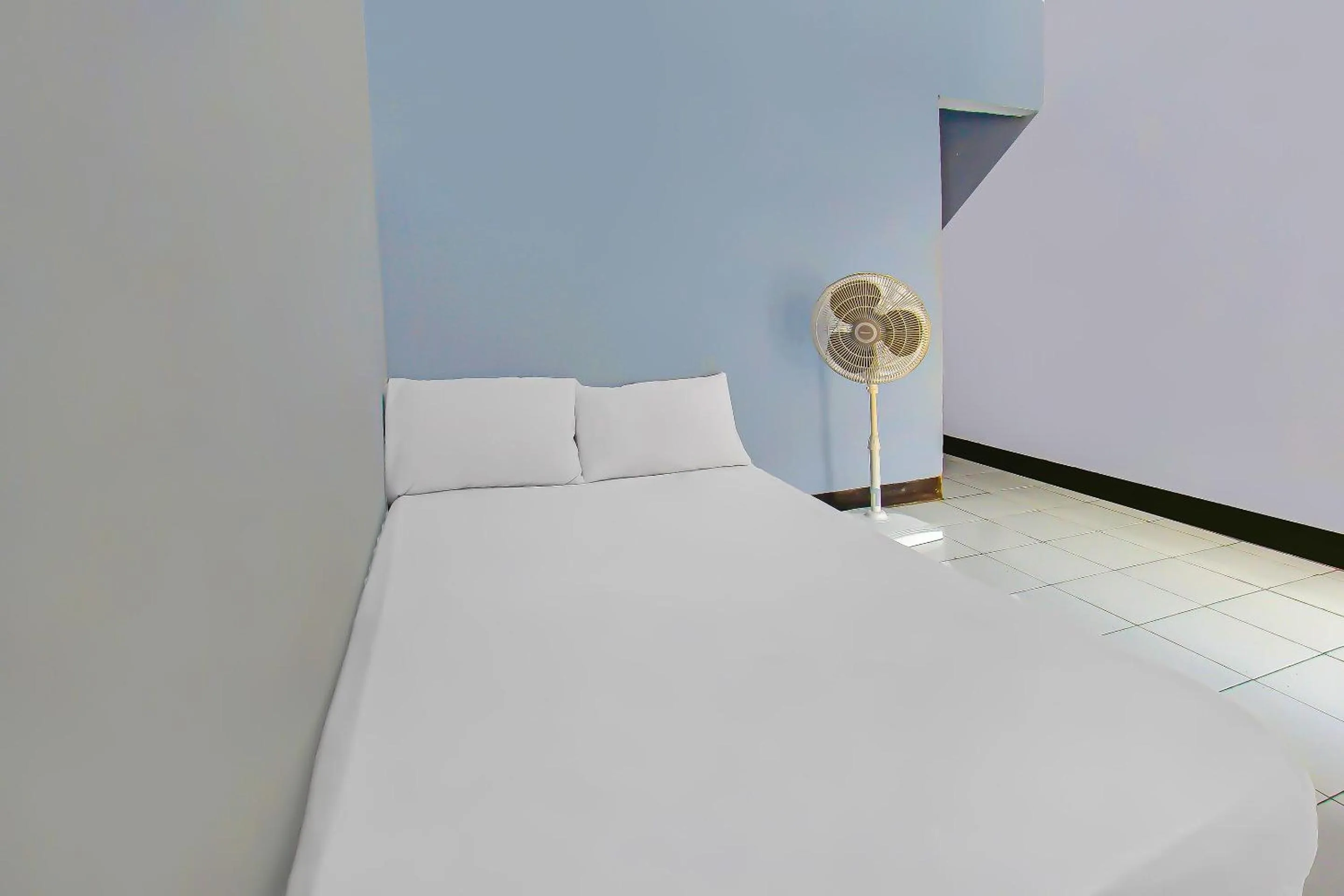 Bedroom in Hotel O Sukandi Homestay Near The Semeton Homestay