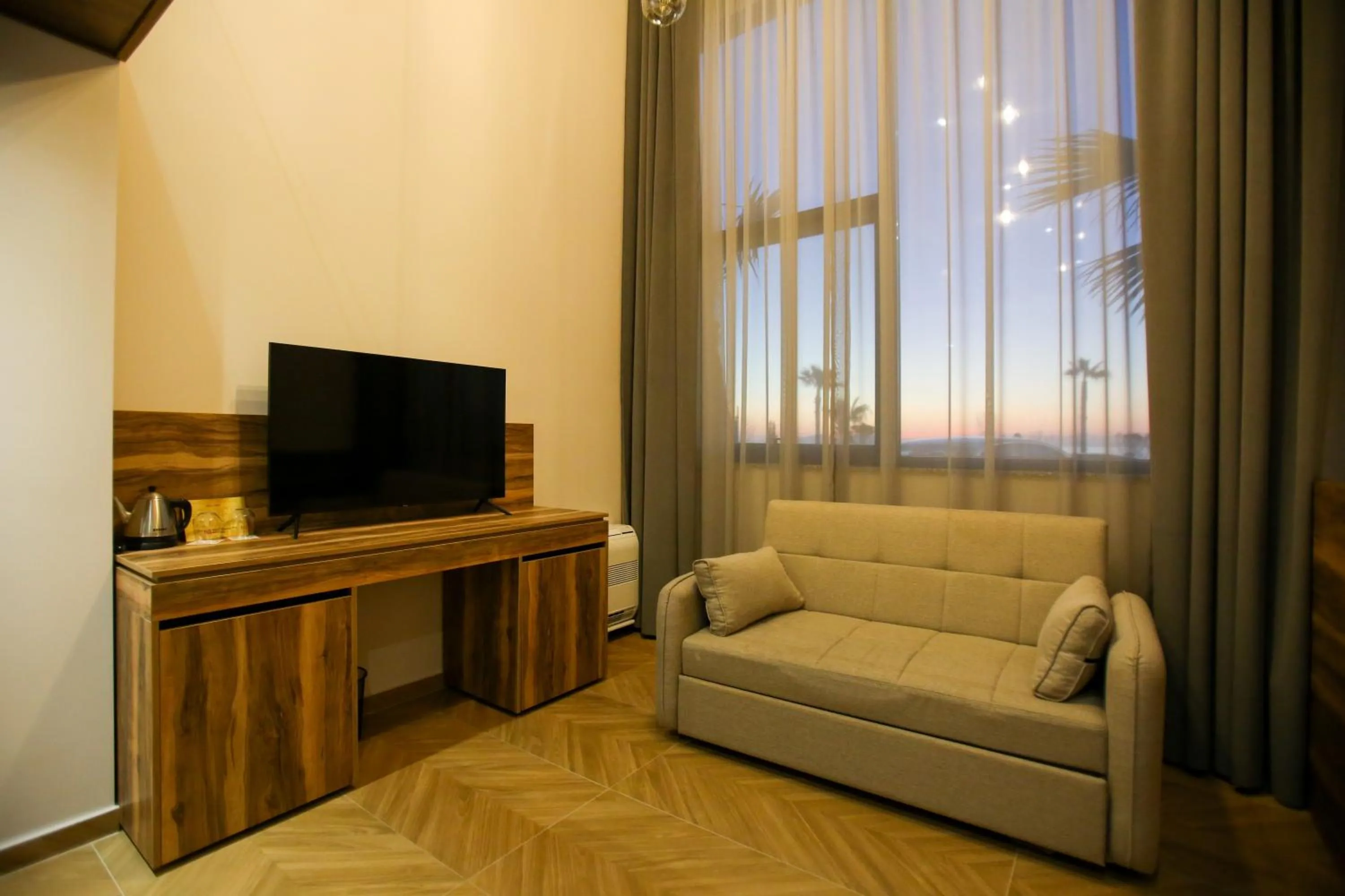 Communal lounge/ TV room in Belvedere Hotel & SPA