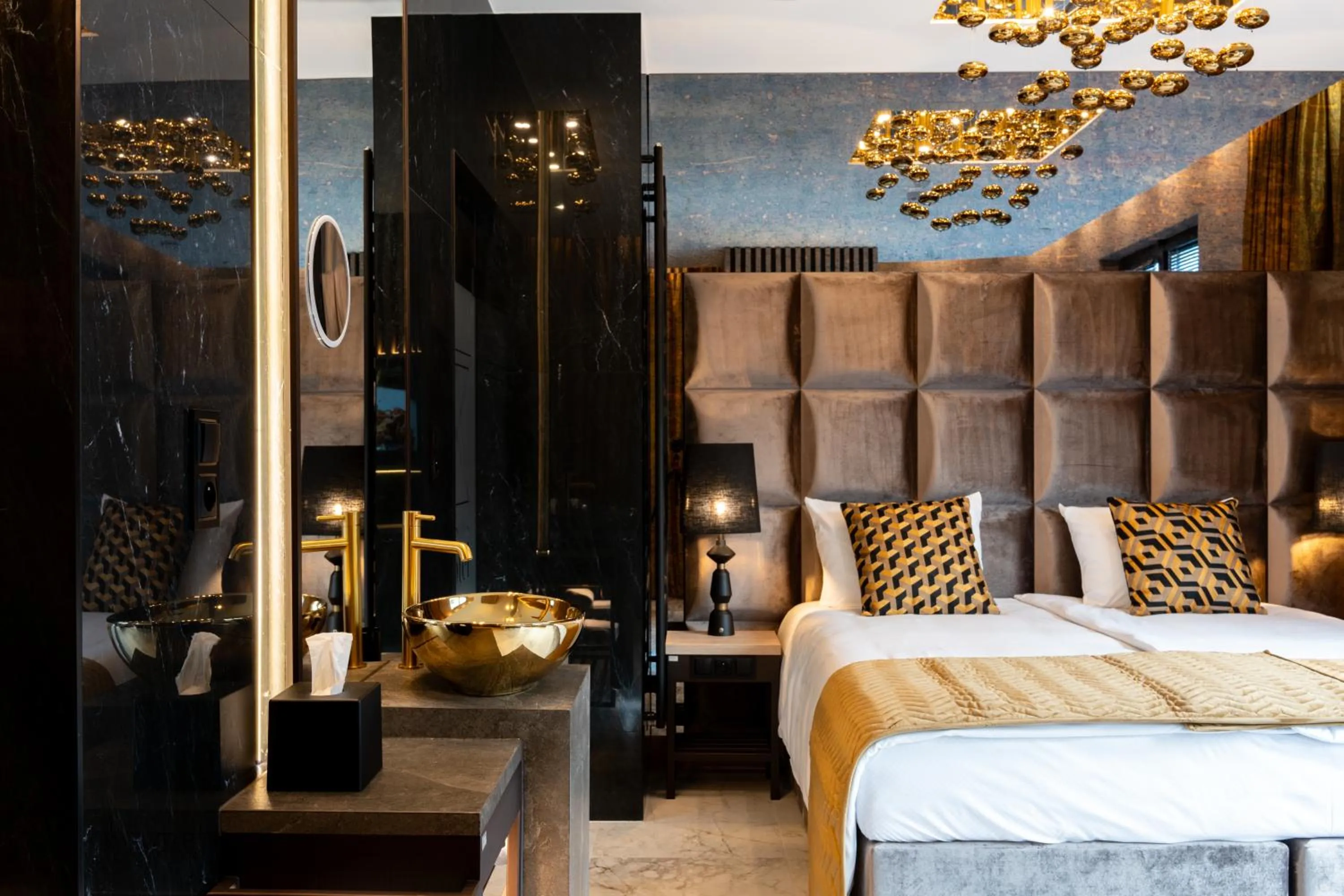 Bed in Art Suites Luxury Hotel