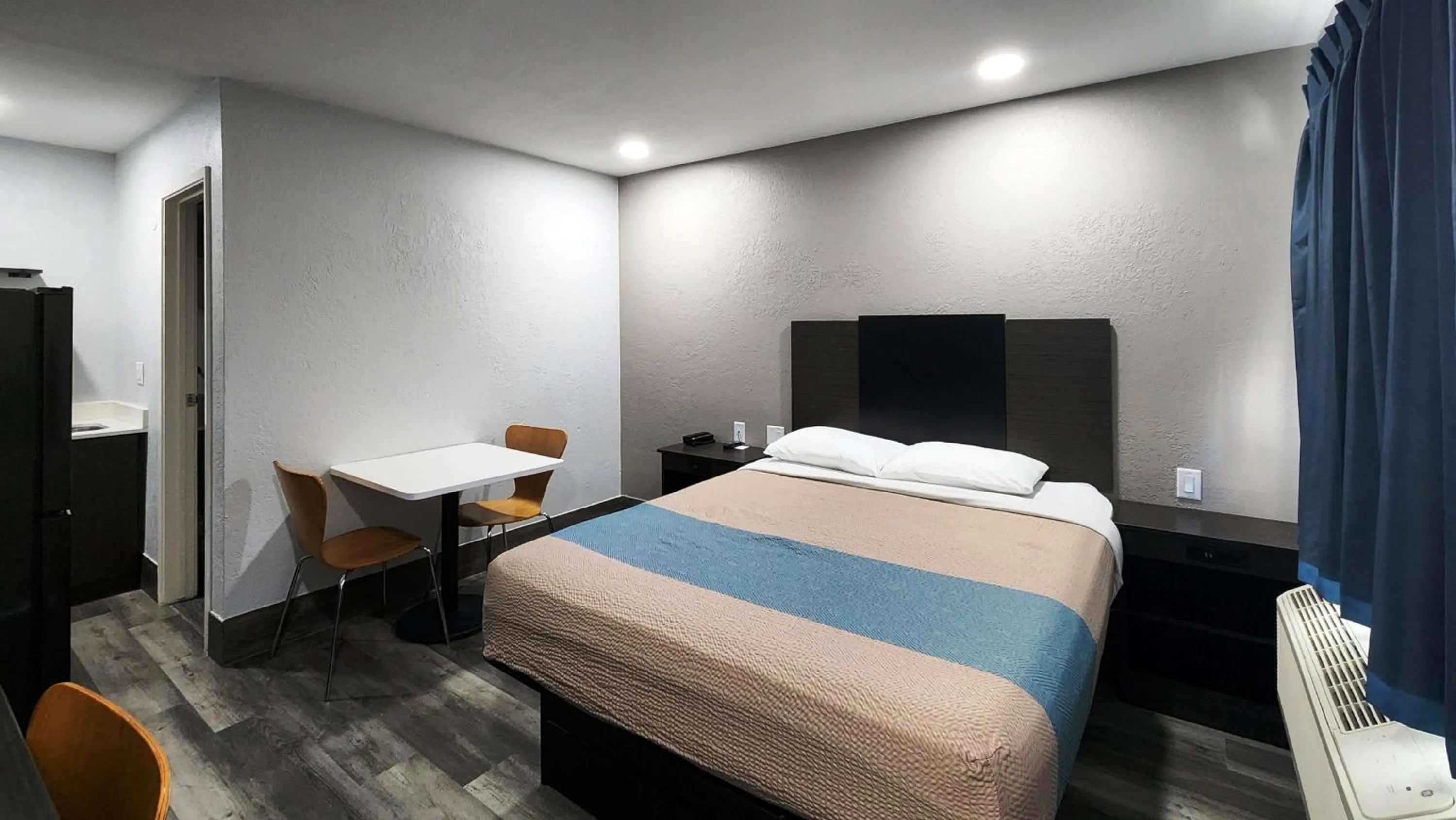 Seating area, Bed in Studio 6 Galveston TX