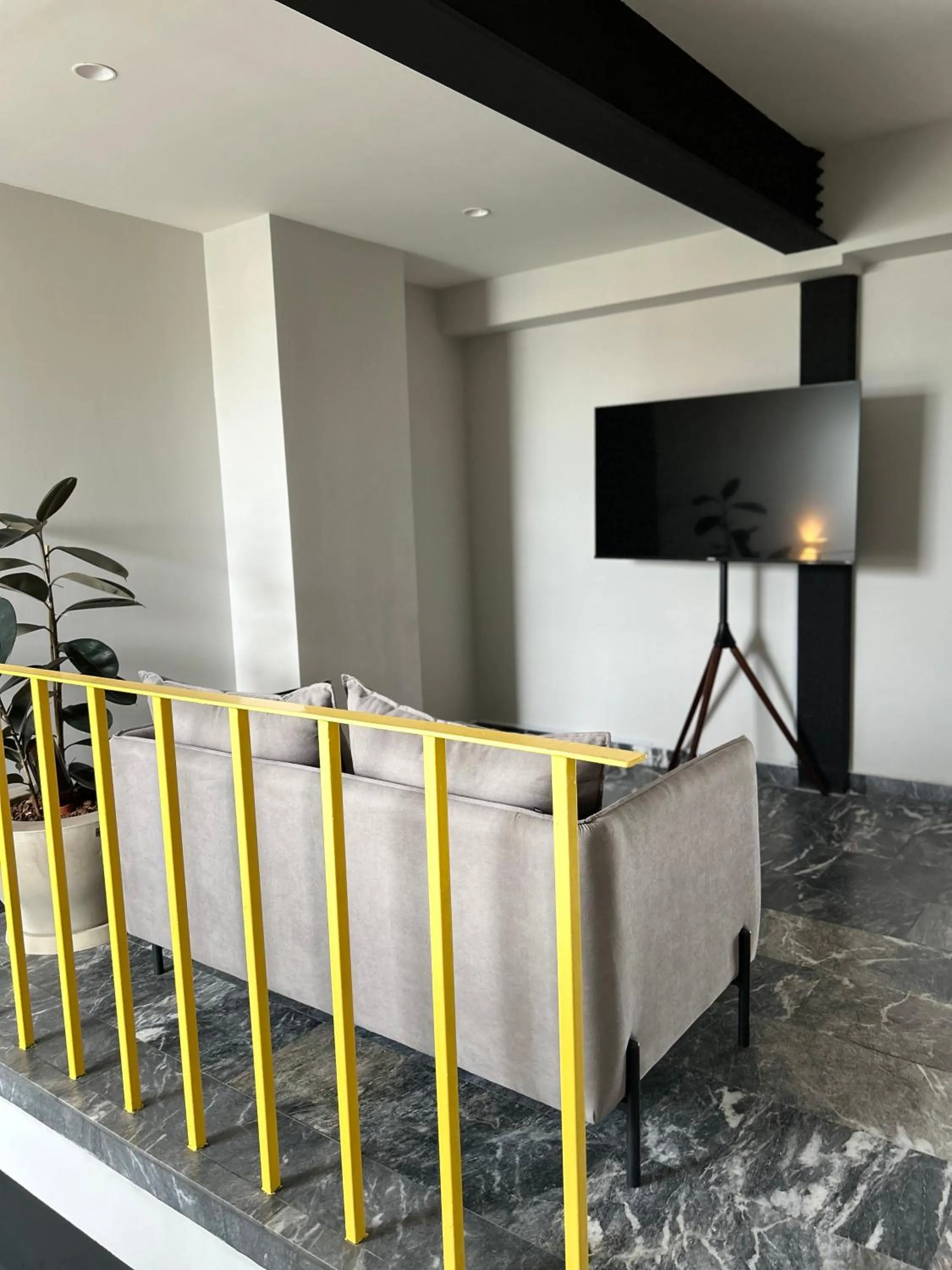 Communal lounge/ TV room in Arquimedes 138 by Wynwood House