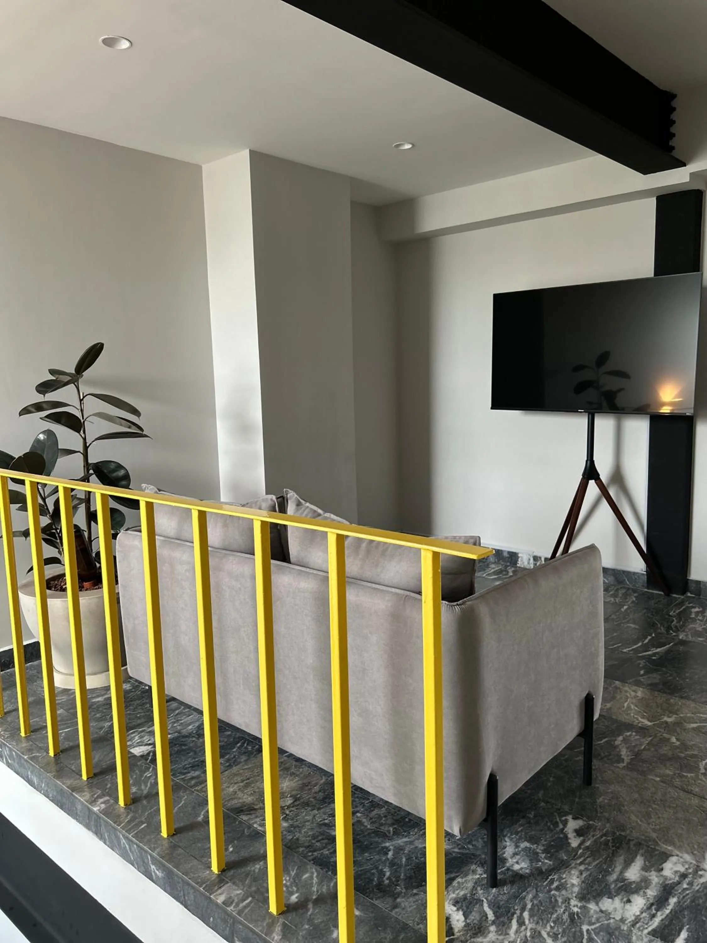 Communal lounge/ TV room in Arquimedes 138 by Wynwood House