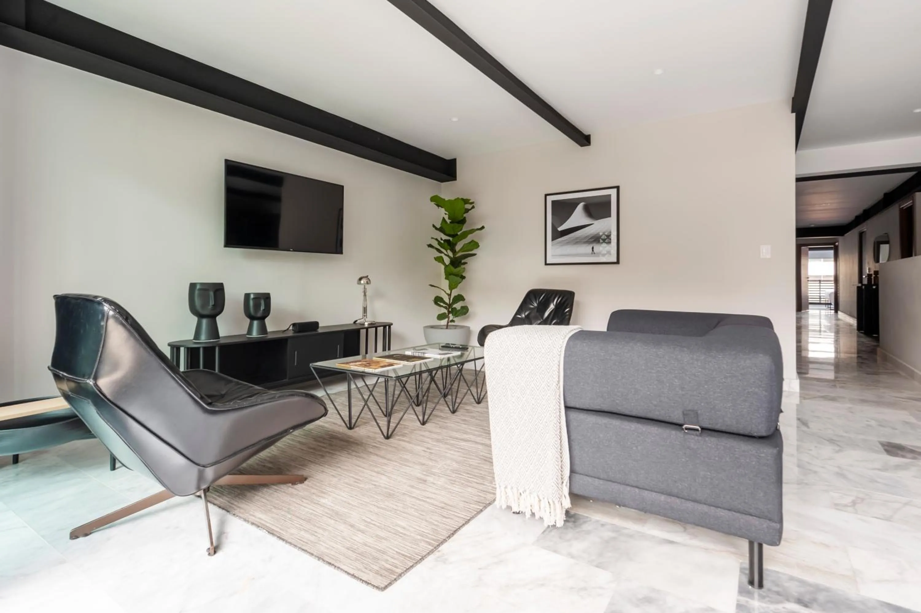 Seating area in Arquimedes 138 by Wynwood House