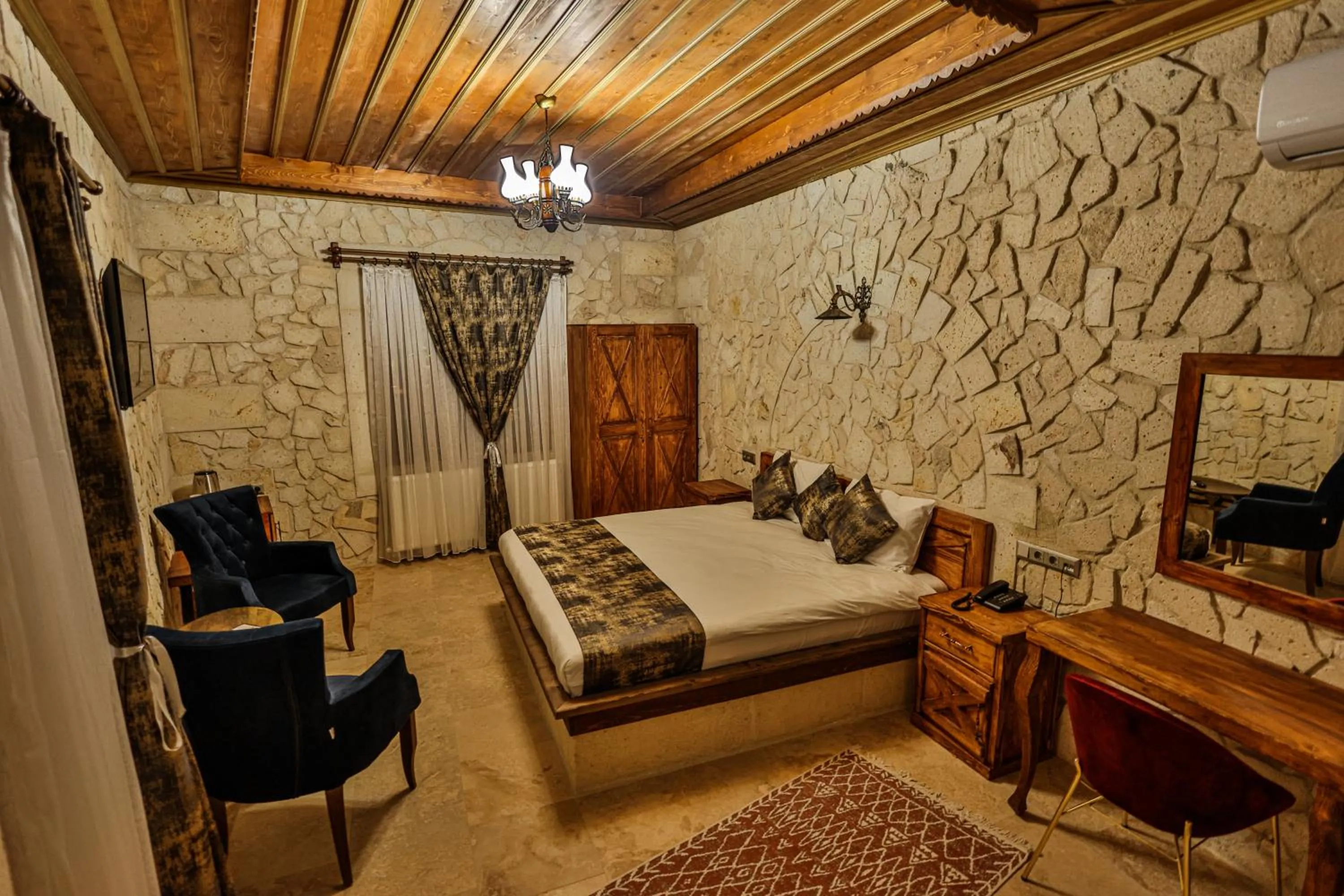 Photo of the whole room, Bed in CaveAdocia Stone&Cave Hotel