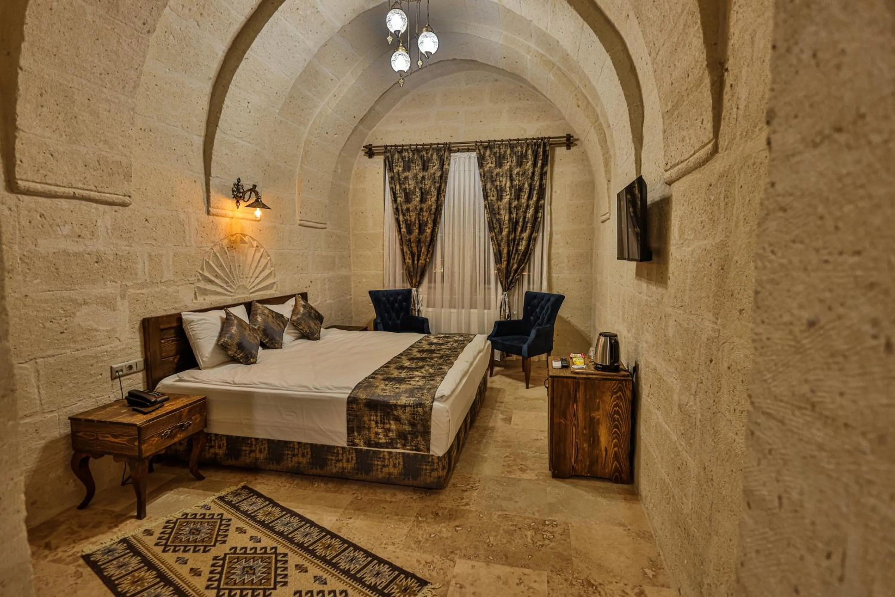 Photo of the whole room, Bed in CaveAdocia Stone&Cave Hotel