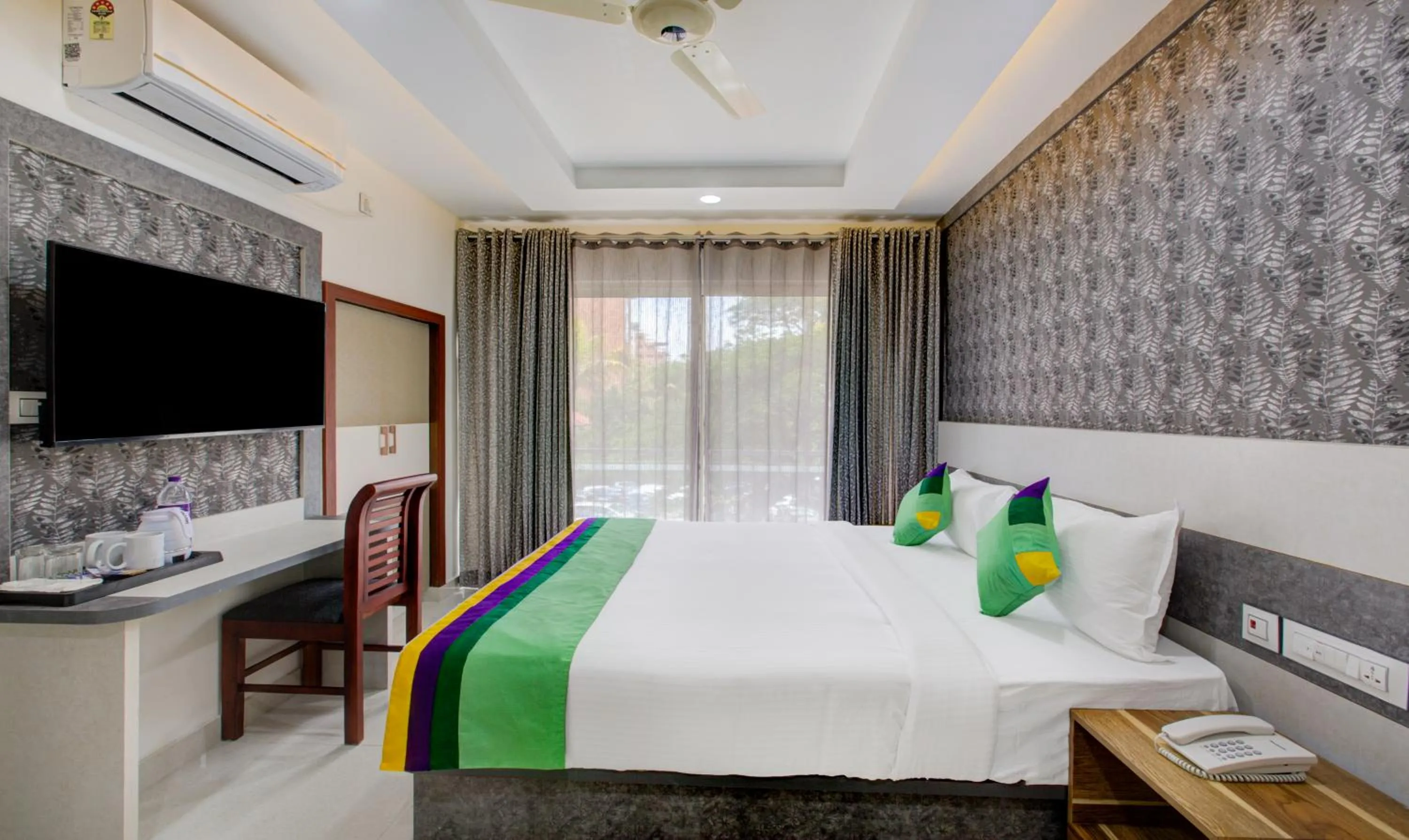 TV and multimedia, Bed in Treebo Love Shore Residency, Near Lakeshore Hospital