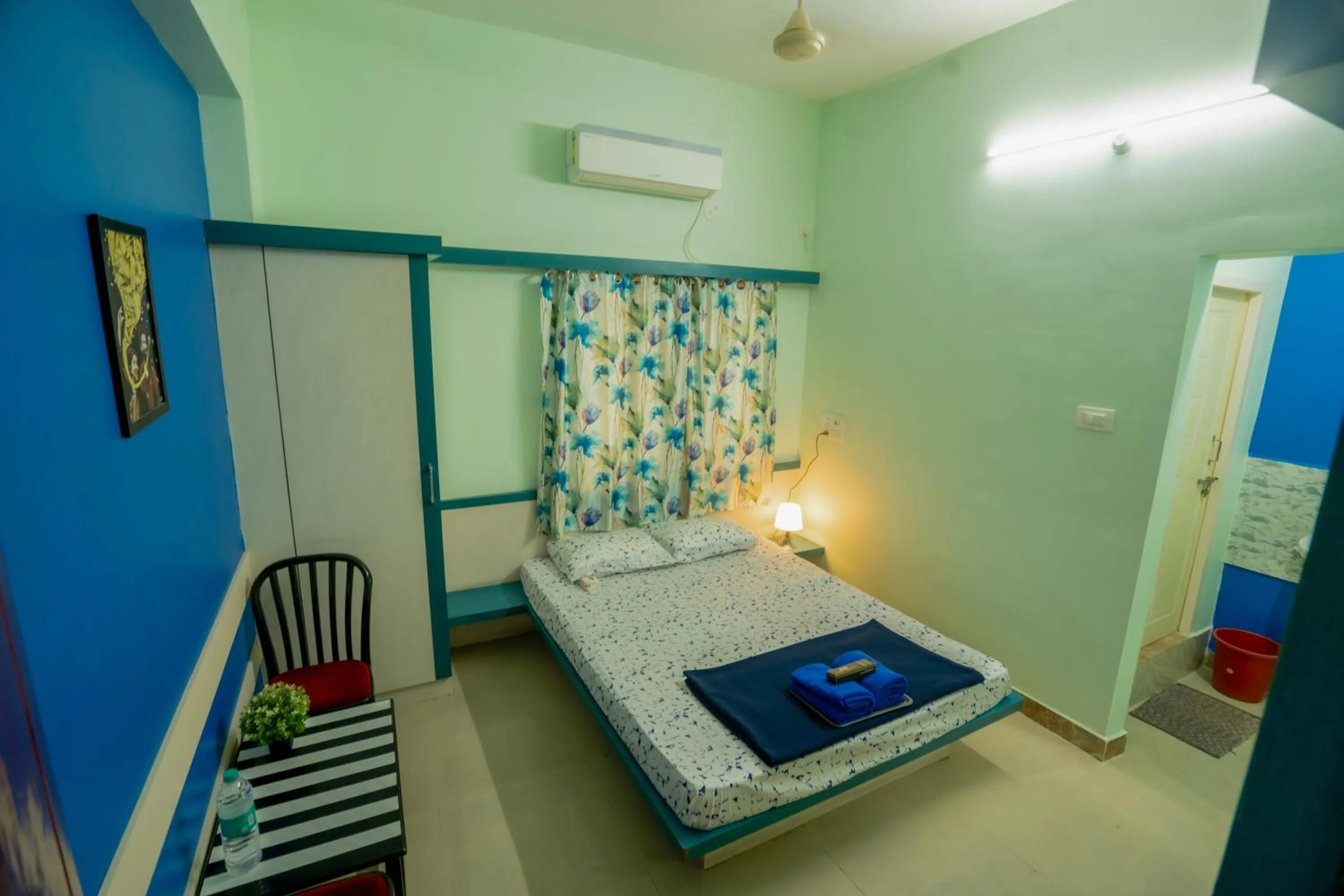 Photo of the whole room, Bed in Sree Theja Residency