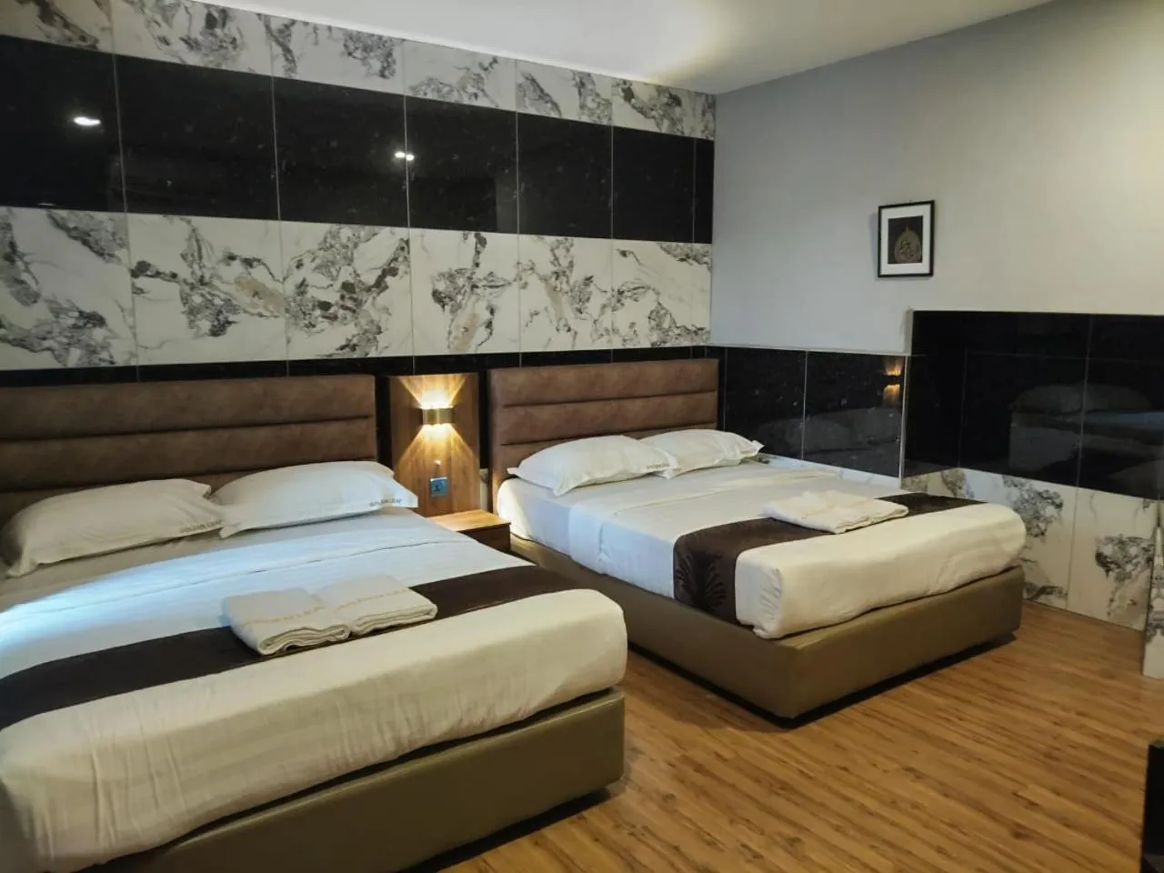 Bed in Golden Leaf Boutique Hotel Nusa Idaman Formerly Known as Ariana Hotel