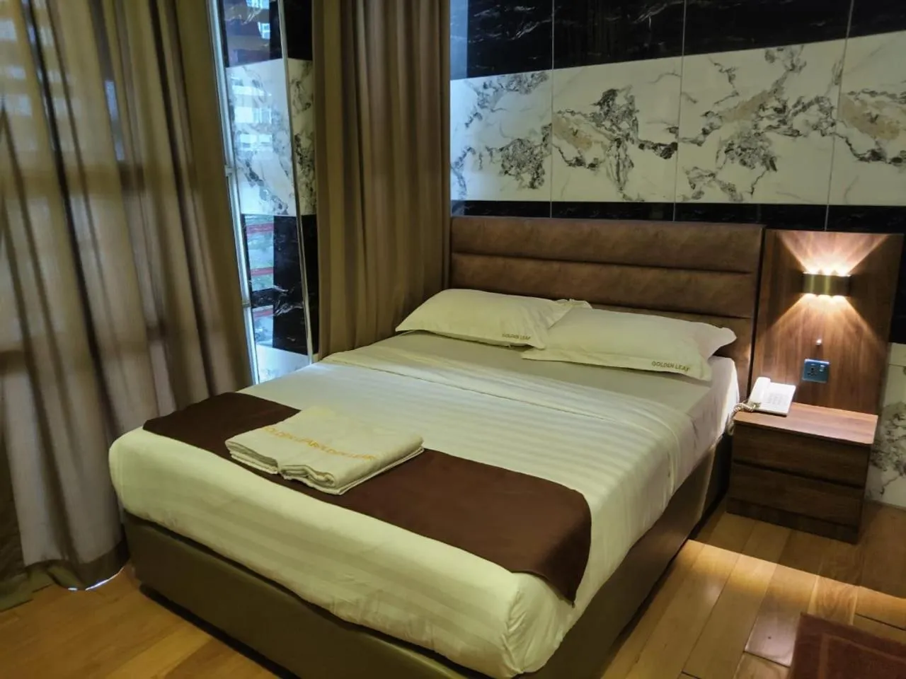 Bed in Golden Leaf Boutique Hotel Nusa Idaman Formerly Known as Ariana Hotel
