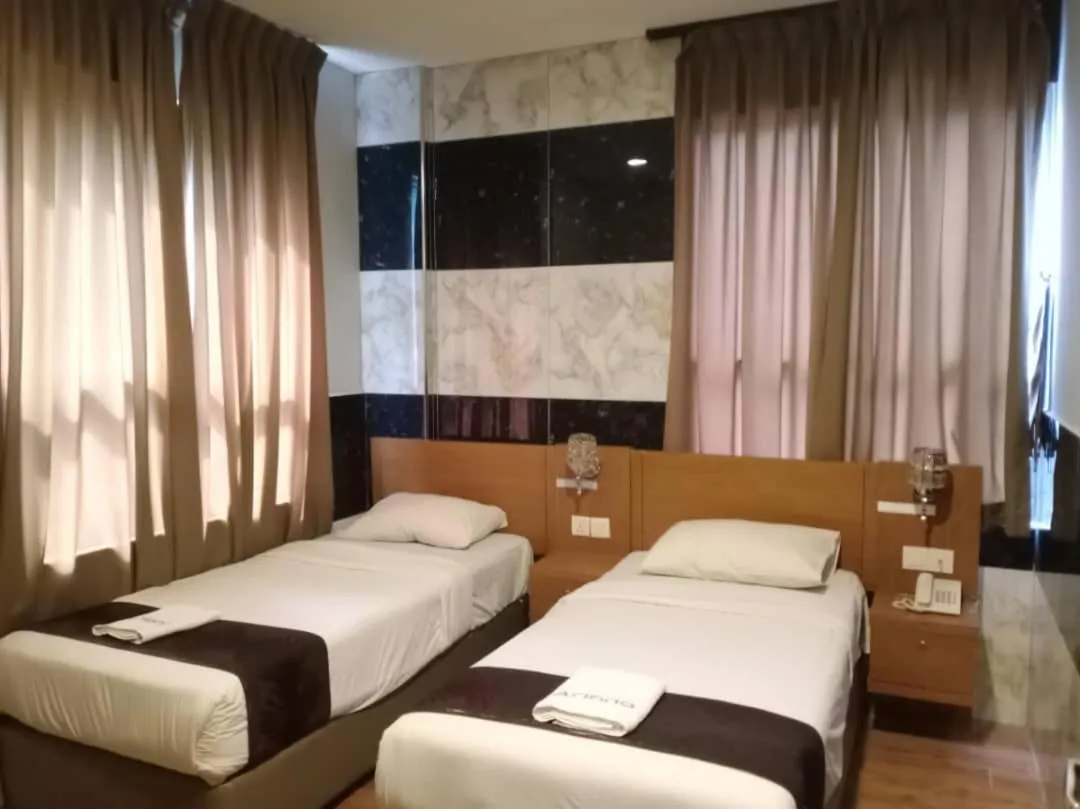 Bed in Golden Leaf Boutique Hotel Nusa Idaman Formerly Known as Ariana Hotel