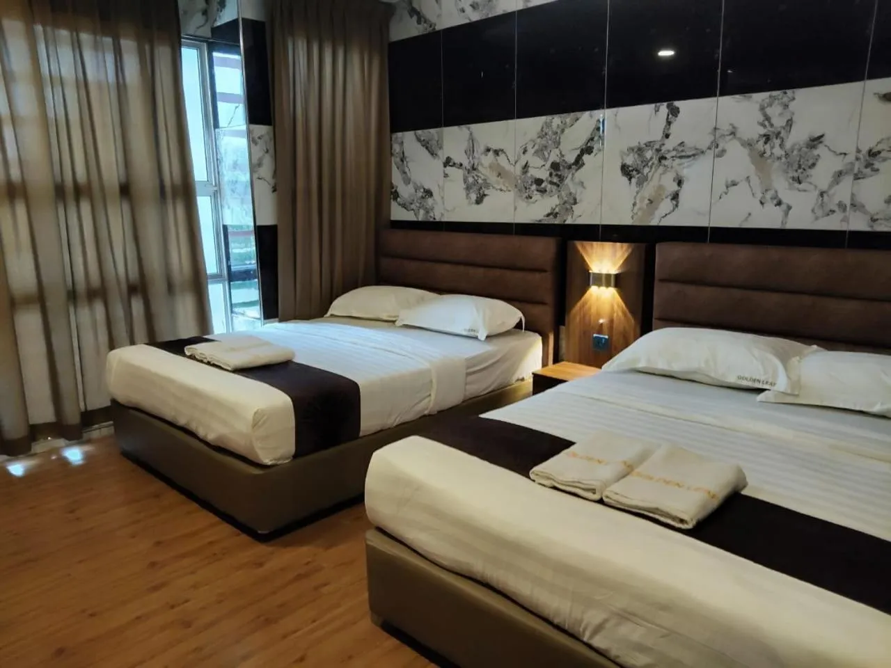 Bed in Golden Leaf Boutique Hotel Nusa Idaman Formerly Known as Ariana Hotel