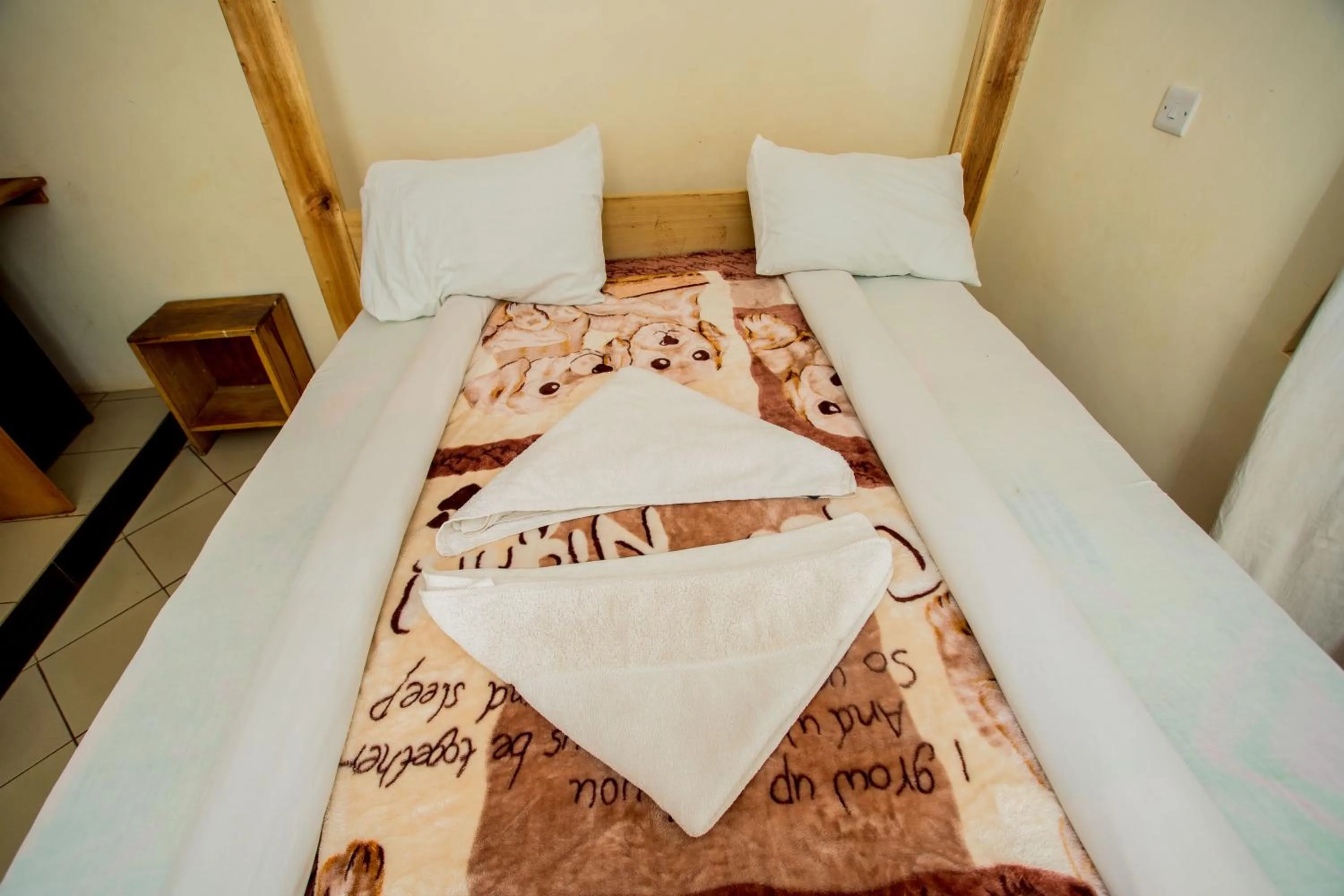 Bed in The Secret Garden Hotel Moshi