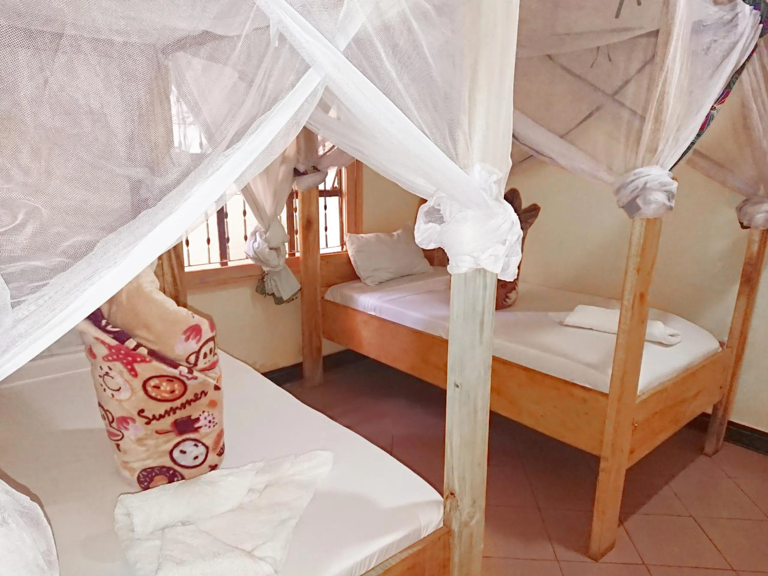 Bed in The Secret Garden Hotel Moshi