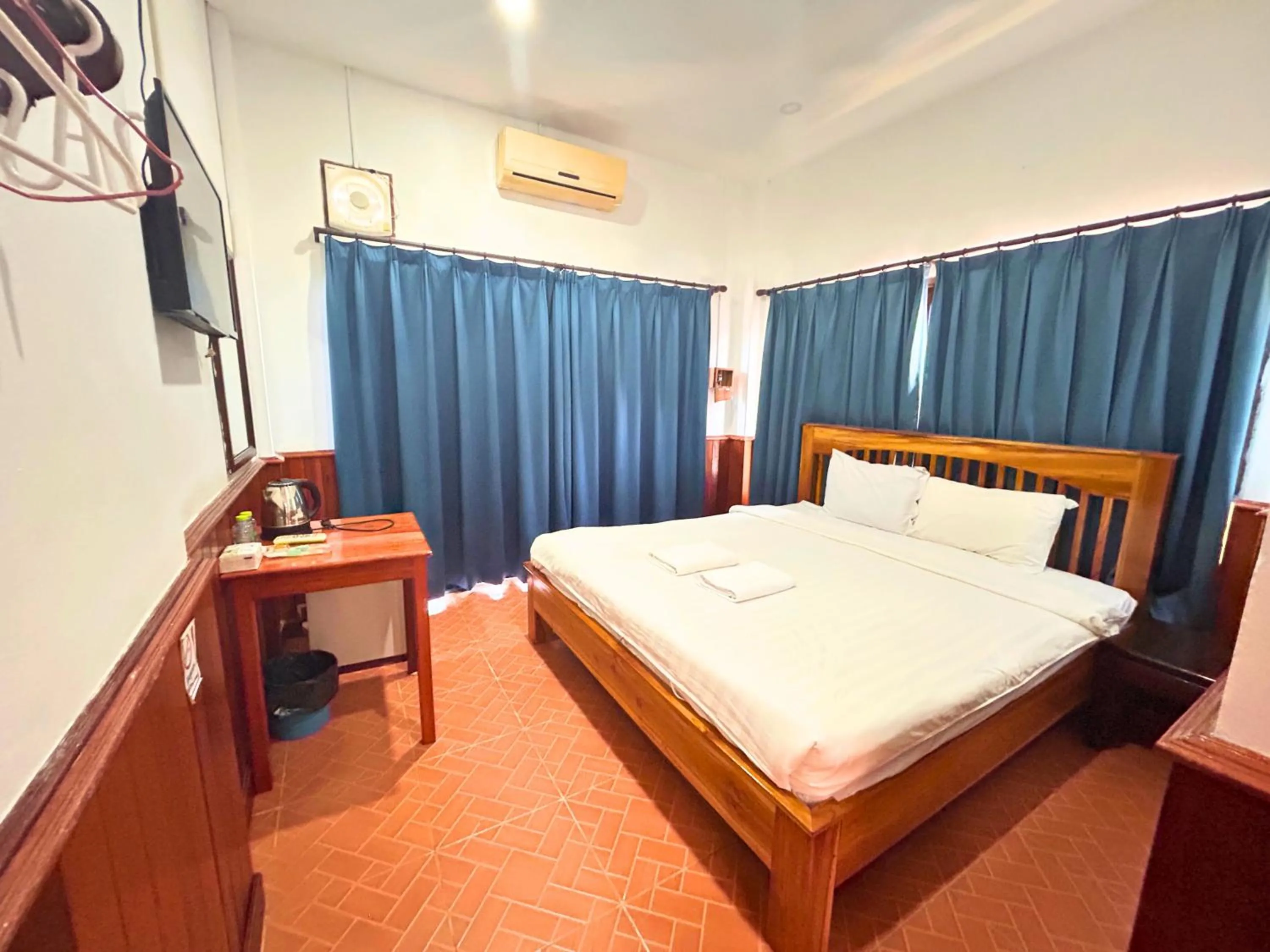 Bed in Domon Riverside Hotel