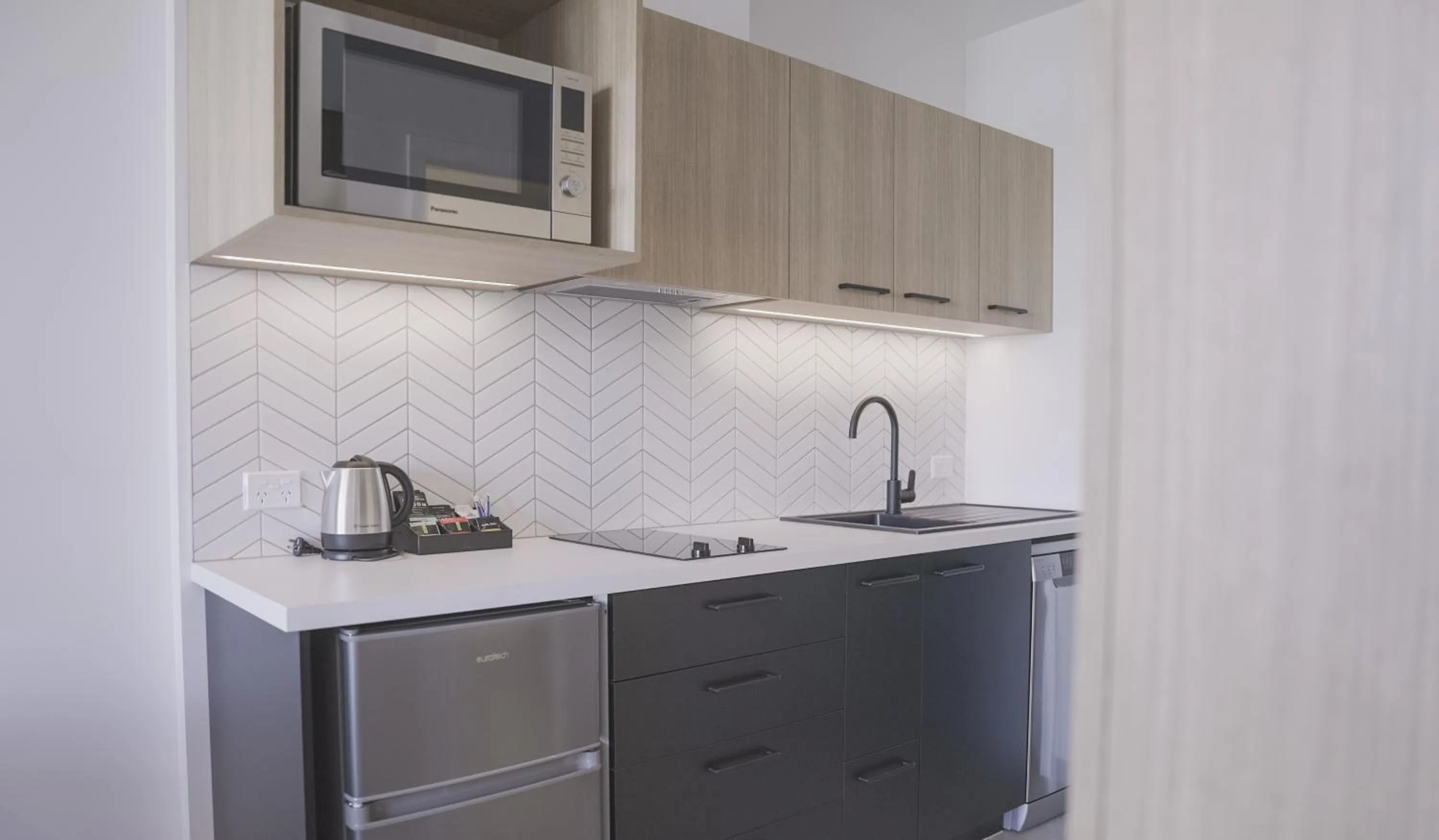 Kitchen or kitchenette in Quest Mt Maunganui