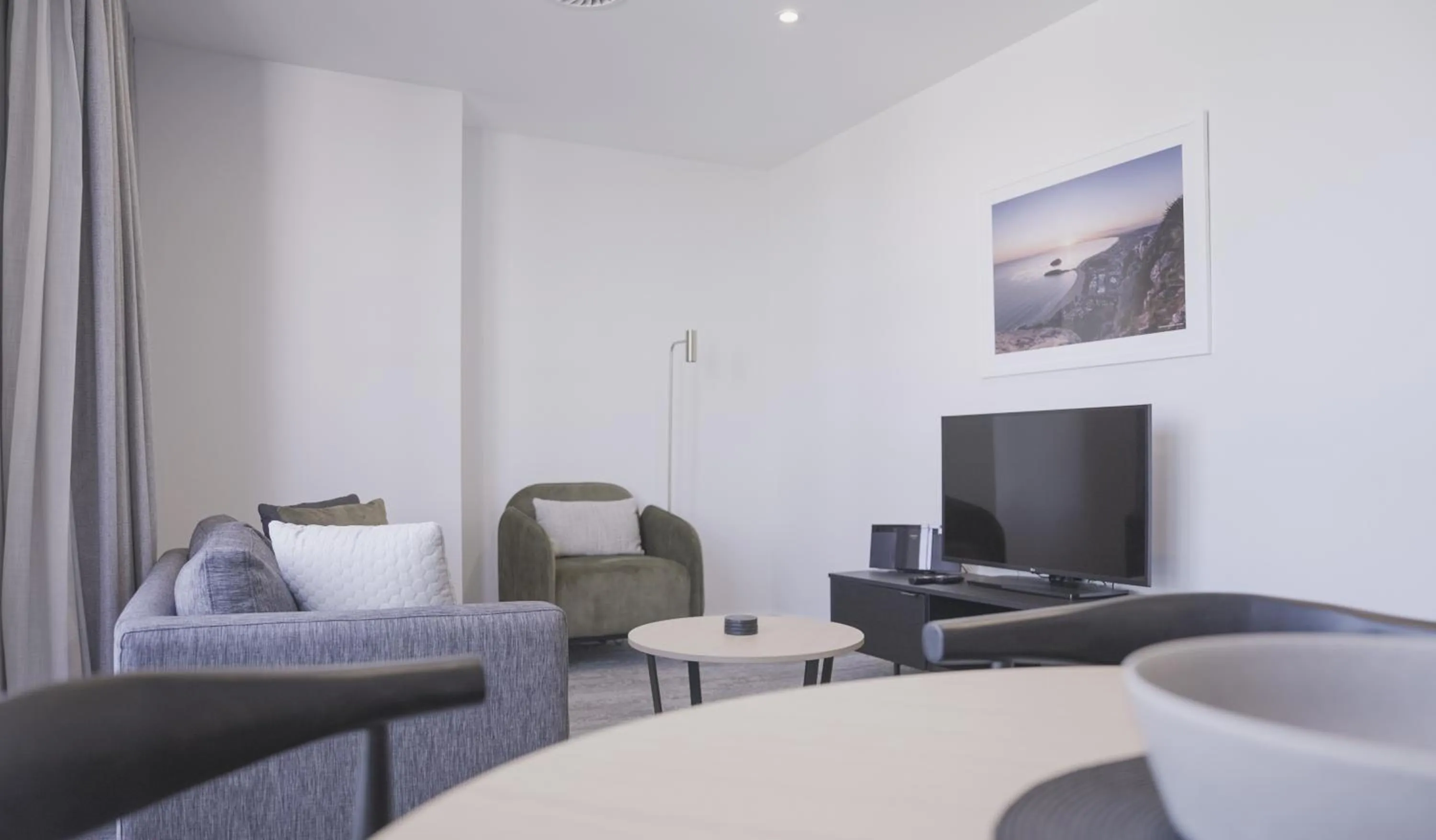 Communal lounge/ TV room, Bed in Quest Mt Maunganui