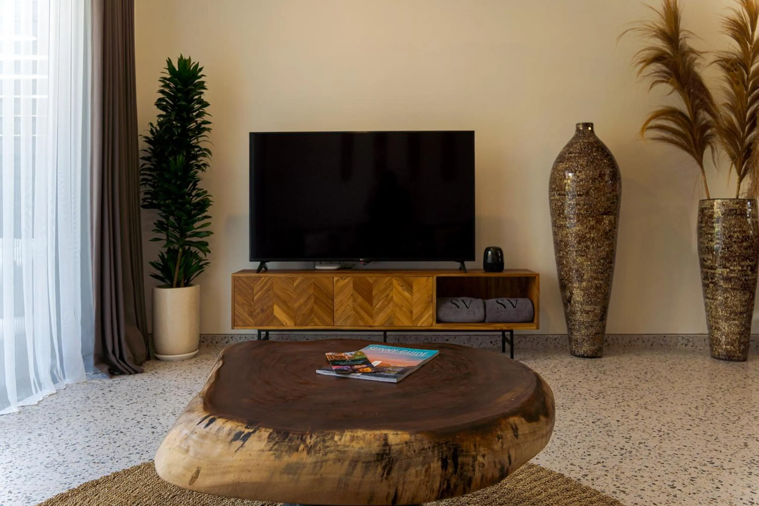 Communal lounge/ TV room in Sunny Village Batu Bolong