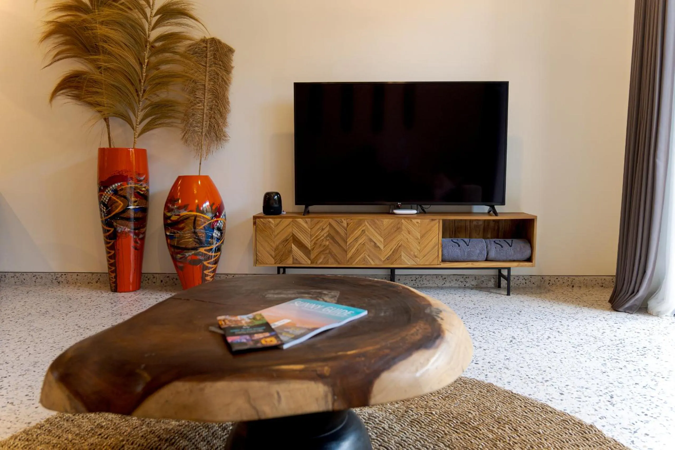Communal lounge/ TV room in Sunny Village Batu Bolong