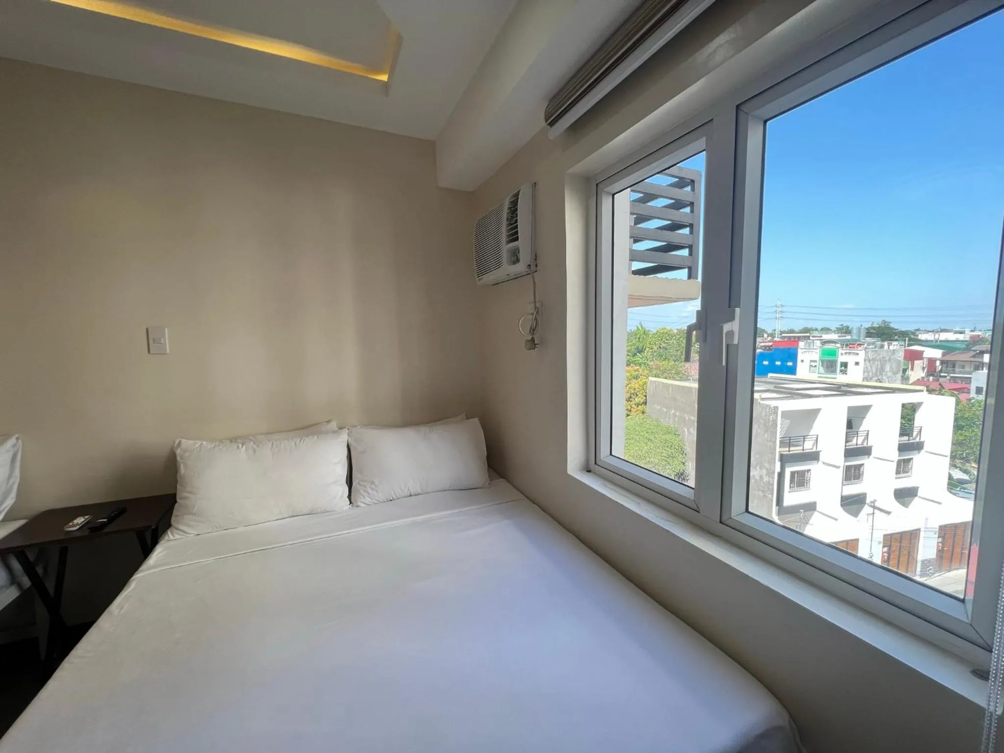 Bed in Staycation Condotel Room To Stay
